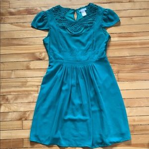 Green scallop should and lace neck dress